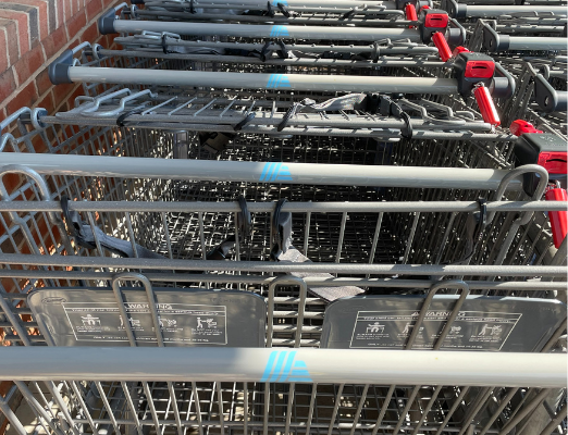 Close up of Aldi shopping carts with blue logo.