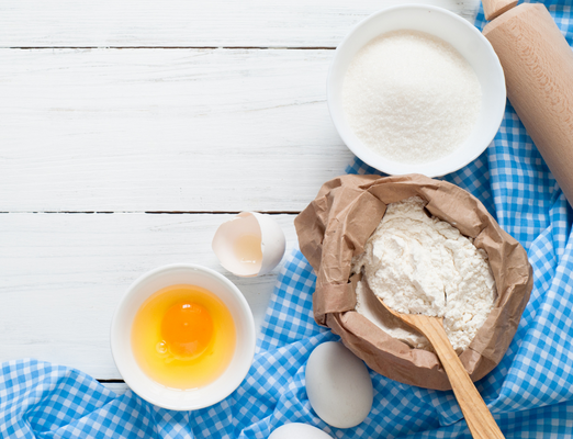 Baking ingredients with a blue gingham cloth